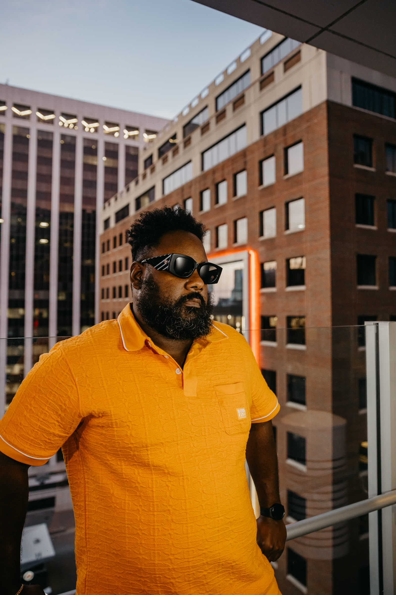 thatjermaine.wav — terracotta polo, golden hour, Raleigh skyline